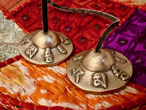 Tibetan Tingsha Bells, also known as chimes, trace back to ancient Tibet and have deep historical and cultural symbolism in Buddhist traditions. Not only do these chimes provide harmonious sound but they also enhance mindfulness and facilitate meditation practices. #harmony #sound #bells #tingshabells #meditation #mindfulness #chimes #holistic #holisticpractises #vibration #symbols #frequencies #vibrate Tingsha Bells, Women Talking, Buddhist Traditions, Women Talk, Meditation Practices, Online Magazine, Tibet, Meditation, Sound