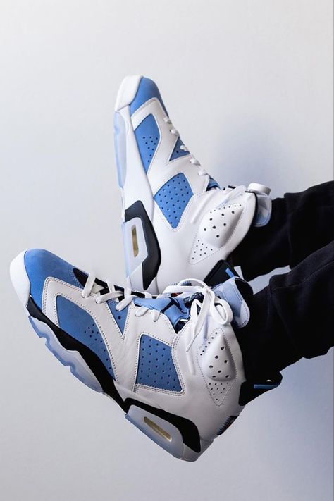 Inspired by Michael Jordan's alma mater, the Air Jordan 6 "UNC" variation features a “University Blue” tone that floods the tongues, satin throat overlays, and the nubuck underlays, while the surrounding leather paneling is done in white. A Jordan badge affixed to the lower heel, and a translucent outsole completes the look. Click to learn more about the upcoming Air Jordan 6 release slated for early March, just in time for the NCAA March Madness tournament. Jordans 6, Hypebeast Shoes, Retro Basketball Shoes, Nike Air Jordan 6, Jordan Shoes Retro, Shoes Sneakers Jordans, Cheap Jordans, Outfit Shop, Shoes Outfit