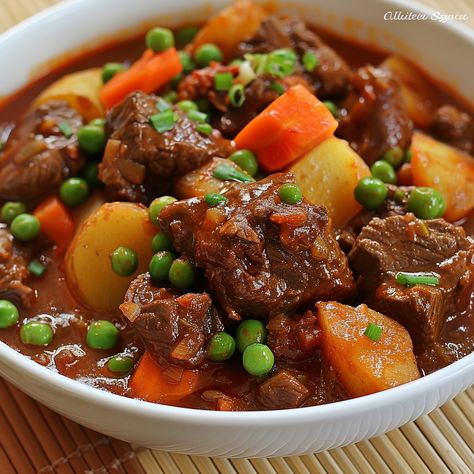 🥩 Indulge in our hearty Caldereta! 🍲✨ #BeefStew #FilipinoCuisine Caldereta (Filipino Beef Stew) Ingredients: Beef chunks (1 kg) Tomato sauce (1 cup) Green peas (1/2 cup) Carrot, sliced (1) Potato, diced (2) Bell pepper, sliced (1) Liver spread (2 tbsp) Garlic, minced (3 cloves) Onion, chopped (1) Soy sauce (2 tbsp) Bay leaves (2) Water (4 cups) Salt and pepper to taste Oil (2 tbsp) Instructions: Sauté garlic and onion in oil until fragrant. Add beef and brown on all sides. Pour in tomato ... Filipino Beef Stew, Beef Caldereta, Beef Chunks, Beef Stew Ingredients, Instagram Recipes, Trending Recipes, Bay Leaves, Green Peas, Food Inspo