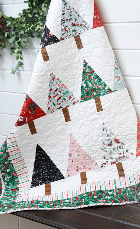 Try this Easy Beginner Friendly Winter Pines Quilt Tutorial! This quilt is mighty pine! Piece a beginner-friendly Winter Pines Quilt using the Missouri Star pattern and cheery Twas fabrics by Riley Blake designer Jill Howarth. Winter Pines Quilt Pattern, Mini Christmas Quilts, Christmas Tree Quilt Block Patterns Missouri Star Quilt, Christmas Quilt Fabric, All Wrapped Up Quilt Pattern Free, Quilting Projects Christmas, Fat Quarter Christmas Quilts, Christmas Tree Quilt Patterns Free Printable, Simple Christmas Quilts