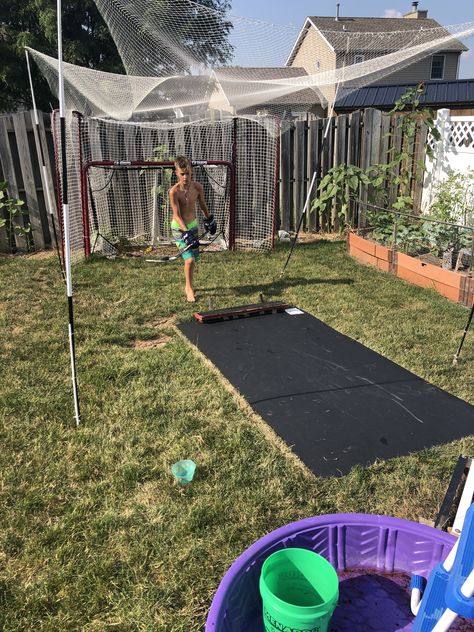 HDPE black 4’ x 8’ plastic board, $55 from Menards hardware store. Compared to $400 for synthetic ice this works great! I will let the lean die underneath and leave this up year round, or until the ice rink is up. DIY rebounder. DIY baseball hitting cage as well Synthetic Ice, Shooting Board, Baseball Hitting, Plastic Board, Ice Rink, Hardware Store, The Ice, Hockey, Baseball