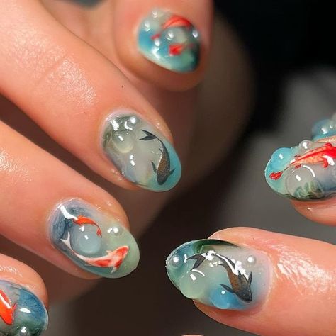 J3N NAILED IT on Instagram: "💧 underwater fish nails for lovely @greta.chaparro 💧 happy birthday!!⭐️🫶🏼🎀 FREESTYLE Builder gel Blossom gel Gosh stickers Pearls 3D gel #ifitwasntj3ndothemagain DM 2 BOOK #londonnails #fulhamnails #nailsoftheday #fish #fishnails #koifish #koifishnails #seanails #swampnails #fishnailart #waternails #bluenails #seanails #aquarium #aquariumnails #fyp #explorepage #safespace #popular #bluenails #greennails #almondnails #birthdaynails #celebnails #bluenails" Nails Fish Design, Nail Fish Design, Coy Fish Nail Art, Fishbowl Nails, Underwater Nail Art, Goldfish Nail Art, Fish Tank Nails, Koi Fish Nail Design, Nail Art Fish