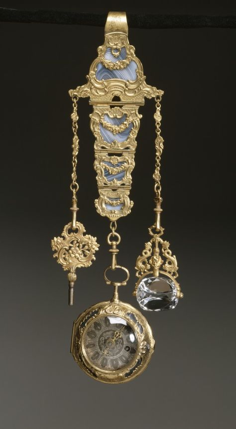 Chatelaine with Watch, 18th c, French, Gold, gilt metal, agate, rock crystal. The watch and chatelaine are decorated with elaborate scrollwork and garlands over beautifully striated agate. The chatelaine is fitted with a watch key and a revolving rock crystal seal, neither of which were likely made at the same time as the chatelaine and watch. Georgian Jewelry, Pendant Watches, Antique Clocks, Antique Watches, Vermeil Jewelry, Chatelaine, Victorian Jewelry, Emerald Jewelry, Rock Crystal