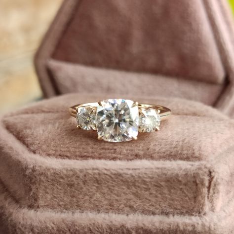 Vintage Three Stone Moissanite Diamond Engagement Ring 14k Yellow Gold Cathedral Setting 2 carat Cushion Cut Engagement Ring with Side Stone, 3 Stone Engagement Rings for Women, 2ct Cushion Cut Moissanite Ring, Three Stone Engagement Ring, Anniversary Ring Gift for Wife, Classic Wedding Ring, Unique Proposal Ring for Girlfriend, Moissanite Jewelry, Bridal Ring, Basket Setting Ring 💎 Center Moisanite Details 💎 ➤Shape: Cushion Cut Moissanite ➤Size: 2.00CT (approx.) ➤Measurement: 7.50x7.50mm ➤Main Stone Clarity: VVS1 ➤Color: D E F ➤Cut Grade: Excellent ➤Moissanite Guarantee: Test Positive By Thermal Diamond Testers & lifetime Brilliance ➤Hardness: Moissanite 9.25 💎 Side Moissanite Details 💎 ➤Shape: Round Cut Moissanite ➤Size: 0.70CTW (approx.) ➤Color: Colourless ➤Clarity: VVS 💍 Metals De Simple 3 Stone Engagement Rings, Three Piece Engagement Ring, Solid Gold Engagement Ring, Cushion Cut 3 Stone Engagement Ring, Unique Three Stone Engagement Rings, Vintage 3 Stone Engagement Rings, Cushion Cut Three Stone Engagement Ring, 3 Stone Cushion Engagement Ring, Vintage Unique Engagement Rings