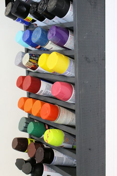 We had a bunch of spray paint cans in our garage and needed a good place to store them. So I built this awesome wall mounted paint can holder. It can hold up to 50 cans, which should be great for most workshops. #paint #garage #organize #diy #workshop #make #build Paint Storage Diy, Spray Paint Storage, Storage Furniture Design, Craft Paint Storage, Paint Rack, Paint Organization, Diy Spray Paint, Garage Organization Diy, Garage Tool Storage