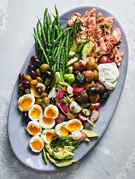 Salmon Niçoise Salad with Garlic-Herb Dressing Recipe | Saveur Composed Salad, Herb Dressing Recipe, Salmon Nicoise Salad, Keto Salad, Classic French Dishes, Nicoise Salad, French Recipes, Wild Salmon, French Dishes