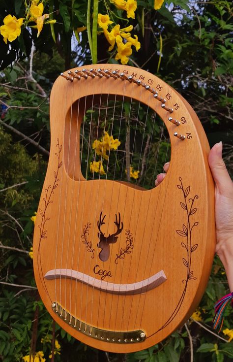 a beautiful wooden lyre, such a magic instrument. green leaves and yellow flowers are behind it! Celtic Instruments, Pretty Instruments, Goal Board, Vision Board Goals, Daily Diary, Celtic Music, I'm In Love, I Can't Wait, Im In Love