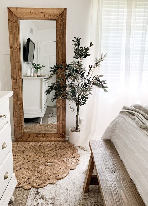 DIY large 6 foot wood floor linear mirror for under $75. DIY wood framed mirror. Wood mirror. Faux olive tree. Jute rug. Layered rugs. Layered Bedroom, Floor Mirror Decor, Diy Wood Floors, Cheap Diy Home Decor, Dekorasi Kamar Tidur, Wood Framed Mirror, Layered Rugs, Framed Mirror, Bedroom Mirror