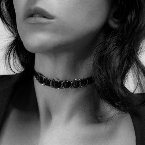 This striking black satin choker is a perfect blend of edgy sophistication and timeless allure. Crafted from a luxurious 10mm wide black satin elastic, it comfortably wraps around your neck, offering a smooth, sleek fit. The design is elevated by 13 interwoven, polished gold-tone O-rings, creating a modern yet understated aesthetic. #chokemecouture #chokers #chokernecklace #chokerstyle Satin Choker, O Ring Choker, Choker Style, Effortless Chic, O Ring, Black Satin, Choker, Choker Necklace, Everyday Wear