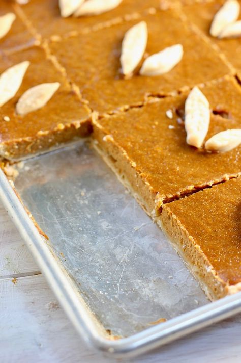 This delicious & simple sheet pan pumpkin pie is a new twist on an old classic! Cooked & served on a sheet pan, it serves a crowd of 20-24 people. #thanksgiving #pumpkinpie #slabpie #pumpkin #sheetpan #easydessert #thanksgivingdessert #dessertforacrowd Sheet Pies Thanksgiving, Pumpkin Pie Squares Easy, Pumpkin Pie 13x9, Pumpkin Sheet Pie Recipe, Sheet Pumpkin Pie, Pumpkin Pie In A Sheet Pan, Sheet Pan Pumpkin Pie Recipe, Pumpkin Pie Sheet Cake, Pumpkin Pie Bars With Pie Crust