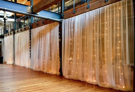 Sheer fabric draping backed by vertical market light strands installed by Get Lit at Bay 7 (Angus Barn). Room Seperator, Waterfall Lights, Bridal Suit, Fabric Wall Decor, Fabric Draping, Market Lighting, Backyard Reception, Prom 2023, String Lights Wedding