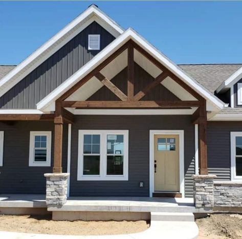 Tan House With White Windows, Black Roof Blue House, Gray Siding House Exterior, Bat And Board Siding Exterior, Dark Grey Siding White Trim, Dark Gray Ranch House Exterior, House Exterior Colors Schemes Grey, Gray Ranch House Exterior, Grey Board And Batten Exterior