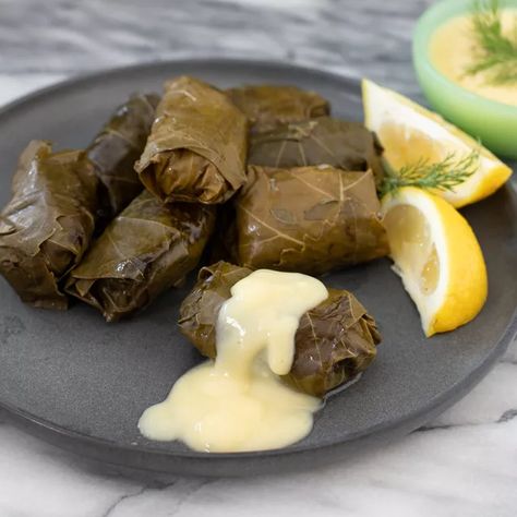 Stuffed Grape Leaves With Meat and Rice Recipe Stuffed Grape Leaves Recipe, Greek Dolmades, Sarma Recipe, Dolma Recipe, Grape Leaves Recipe, Greek Theme, Stuffed Grape Leaves, Mediterranean Food, Lemon Sauce