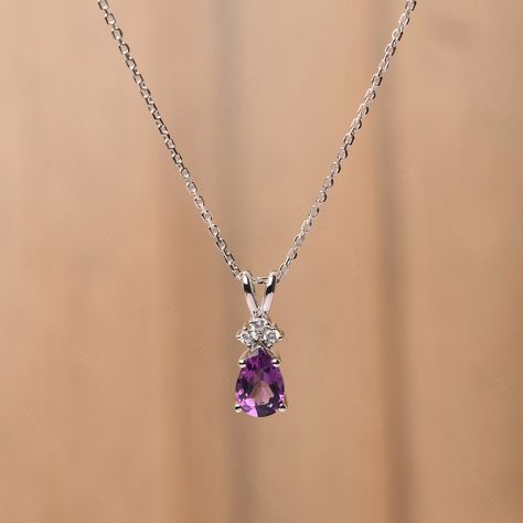 It is a natural amethyst pendant, pear cut, measures 9x6 mm,about 1.34 carats The basic metal is sterling silver and plated with rhodium. To change the metal to a solid gold (white/rose) or platinum is also available, please ask for a quotation if you want. You can also go to my shop Home for more elegant rings:  https://www.etsy.com/shop/godjewelry?ref=hdr_shop_menu Amethyst is birthstone of February More alexandrite rings: https://www.etsy.com/shop/godjewelry?ref=seller-platform-mcnav&section_ Silver Chain And Pendant, Elegant Pendant Earrings, Silver Chains With Pendant, Pendent Silver Pendant Necklace, Silver Pendant Necklace Unique, Platinum Jewelry Necklaces, Amethyst Accessories, Amethyst Jewelry Necklace, Amethyst Necklaces