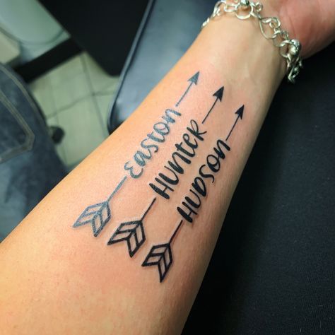 Boy Names Arrows With Names Tattoo, Tattoos With Kids Names For Moms Boys, Tatoos Of Grandkids Names, Arrow Tattoos With Names, Name With Arrow Tattoo, List Of Names Tattoo, Tattoos Children’s Names, Hudson Tattoo Name, Tattoo Ideas For Grandkids Names