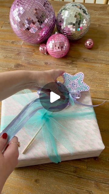 Amanda Hernandez on Instagram: "DIY starfish wand for a mermaid party 🧜🏼‍♀️

When we got the party invite for the sweetest mermaid loving four year old - I knew I had to make her a cute wand to go with her gift ✨ 

I grabbed the star wand from @hobbylobby along with a few ribbons and glitter. 

I used purple paints and a teal glitter since I knew those were the colors for her party. 

Once the paint dried I used a little mod podge in areas where I wanted the glitter to stick. Finished it all off with some ribbons and how cute!! 

This adds such a special touch to the gift and also gives the birthday girl something special to play with. I love how this quick diy turned out 💕 

save and share for your next mermaid or 
princess party 🫶🏻 

Follow @amandamaehome for more ideas ✨ 

#giftide Starfish Wand, Diy Starfish, Gift Ide, Star Wand, Mermaid Gifts, Purple Paint, Quick Diy, Instagram Diy, Mermaid Party