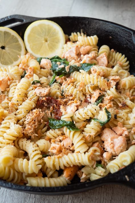 Healthy salmon pasta with sun-dried tomatoes and spinach. A dairy free recipe for busy weeknight dinners. Easy to make in less than 30 minutes. Fresh and light with a touch of lemon. Dairy Free Creamy Salmon Pasta, Salmon Pasta Recipes Dairy Free, Pescatarian Dairy Free Recipes, Salmon Pasta Dairy Free, Dairy Free Pescatarian Recipes, Lactose Free Pasta Recipes, Dairy Free Salmon Recipes, Creamy Salmon Pasta, Salmon Pasta Recipes