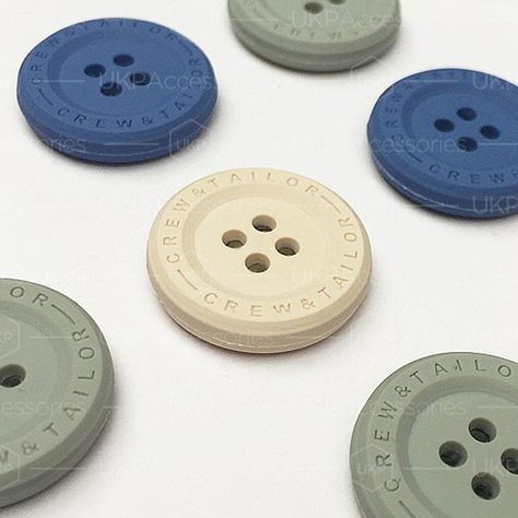 Rubber coated sew-on buttons #trims #sewon #button #custom #bespoke #engraved #branding #logo #fashion #apparel #design #inspiration #ukp Button Inspiration, Trim Tex, Accessories Design Sketch, Button Logo, Apparel Design Inspiration, Buttons Design, Trims Fashion, Button Fashion, Trendy Shirt Designs