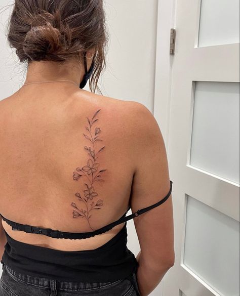 Delicate Floral Spine Tattoo, Orchid Back Tattoo, Flower Back Tattoo Women, Red Floral Tattoo, Floral Collar Bone Tattoo, Lyric Tattoos Placement, Wildflower Spine Tattoo, Simple Back Tattoo Women, Fine Line Back Tattoo