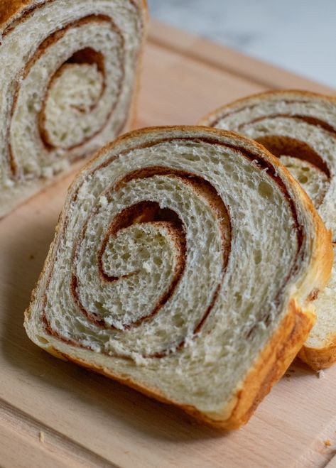 Slices of cinnamon swirl bread on a cutting board. Swirl Bread, Cinnamon Swirl Bread, Cinnamon Raisin Bread, Raisin Bread, Swirled Bread, Sourdough Discard, Cinnamon Raisin, Cinnamon Bread, Cinnamon Swirl