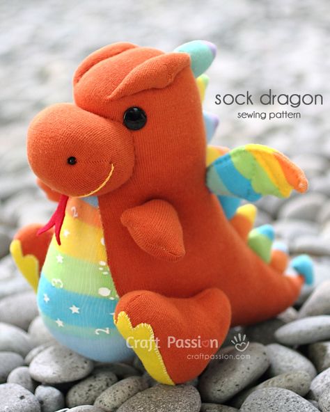 DIY Sock Dragon Sewing Pattern   I might try this with mylar stuffed & sewn into the wings for a tactile baby toy.  Could also add a rattle in the belly or squeakers in the large feet. Sock Monkeys Tutorial, Diy Sy, Sock Dolls, Sock Toys, Pet Dragon, Diy Socks, Sock Crafts, Animal Sewing Patterns, Sewing Stuffed Animals