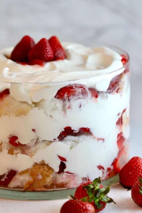 My easy no-bake, Strawberry Trifle with Angel Food Cake is made with fresh, luscious strawberries, heavenly whipped cream, and layers of light-as-a-cloud angel food cake. I guarantee that this make-ahead wonder will be one of the easiest and most delicious desserts you will ever prepare! #trifle #cream #strawberries #summer #dessert #angel #cake Trifle With Angel Food Cake, Strawberry Angel Food Cake, Strawberry Trifle, Trifle Dish, Trifle Desserts, Trifle Recipe, Angel Food Cake, Food Cake, Fresh Strawberries