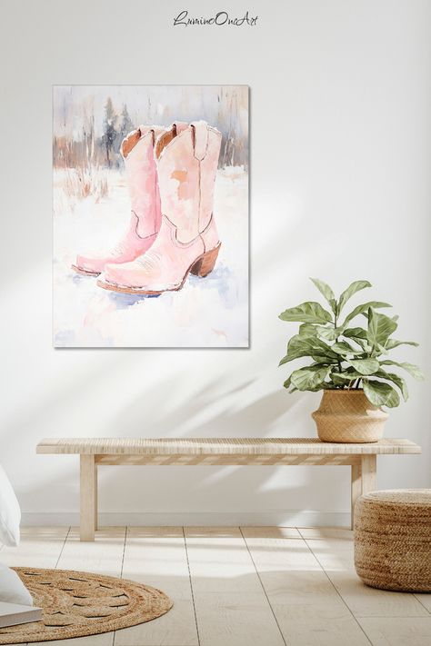 Where rustic meets romance, these pink boots whisper tales of wild western dreams. Create a charming entryway or living room focal point by pairing this piece with natural wood furniture and woven accents. The soft color palette blends perfectly with neutral decor while adding just the right touch of feminine western flair. Want to bring some ranch-inspired magic to your space? Let these boots lead the way home. Cowgirl Aesthetic Room, Charming Entryway, Pink Cowgirl Aesthetic, Cowgirl Winter, Modern Country Home Decor, Living Room Focal Point, Winter Scene Paintings, Modern Country Home, Room Focal Point