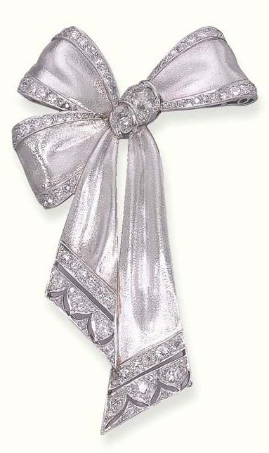 AN ART DECO DIAMOND-SET RIBBON BOW BROOCH. The brushed white bow, with old mine-cut diamond trim, gathered by old European-cut diamonds, to the pierced terminals, circa 1928. #ArtDeco #brooch Bijoux Art Deco, Diamond Ribbon, Ribbon Jewelry, Bow Brooch, Bow Jewelry, Diamond Brooch, Deco Jewelry, European Cut Diamonds, Art Deco Diamond