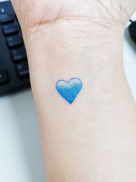 Tiny Blue Heart Tattoo, Blue Tattoo Minimalist, Small Blue Heart Tattoo, Colour Heart Tattoo, Healed Finger Tattoos, Blue Heart Tattoo, Finger Tattoos Fade, Purple Heart Tattoos, Blue Ink Tattoos