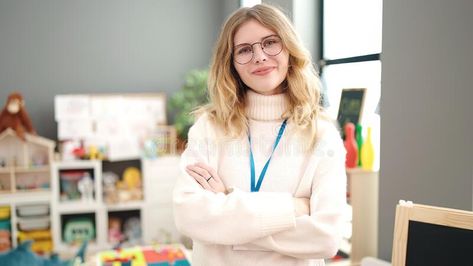 Young blonde woman preschool teacher smiling confident standing with arms crossed gesture at kindergarten royalty free stock photography Blonde Women, Preschool Teacher, Kindergarten Teachers, Stock Photography Free, Portrait Photography, Kindergarten, Preschool, Blonde, Stock Images