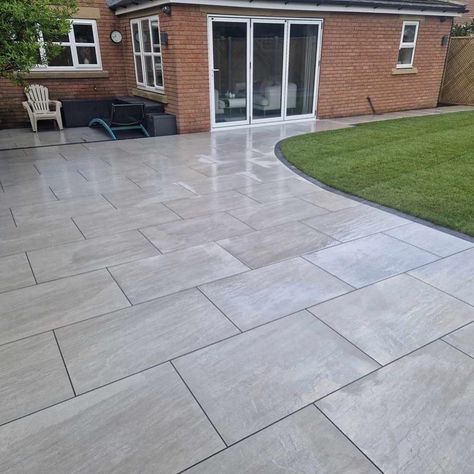 An incredible garden using our Aged Kandla Grey porcelain paving. Norwood Landscapes work in and around the Selby area, creating beautiful gardens in both Sandstone and Porcelain. 📞 Call our team on 01977 782240 💻 Visit our website https://rflandscapeproducts.co.uk/product/aged-kandla-grey-2cm-porcelain-paving/ Details ✔️ Product : Aged Kandla Grey Paving Format: 600x900mm Material: Porcelain Paving Credit - Norwood Landscapes . . . ✔️ Trade accounts available ✔️ Sample kits availabl... Walkway Pavers, Grey Paving, Porcelain Paving, Patio Garden Design, Walkway, White Porcelain, Patio Garden, Beautiful Gardens, Garden Design