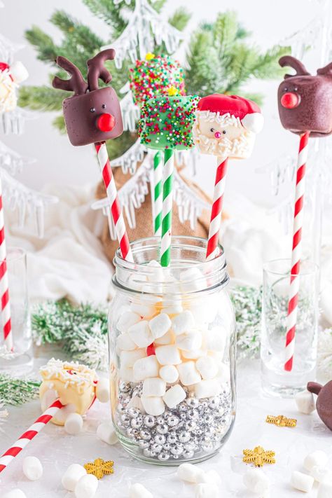 These festive marshmallow pops are the cutest treat for your holiday gatherings. They're coated in rich Belgian chocolate and given a splash of color with chocolate candy melts. You can easily jazz them up with fun toppings like sprinkles and pretzels. Plus, there’s a fun tutorial for making Santa and Rudolph, plus easy instructions for creating a cheerful Christmas tree marshmallow. Get ready to spread some holiday cheer by making your own Christmas marshmallow pops. They're so cute AND tasty! Decorated Marshmallows, Santa And Rudolph, Christmas Dip, Dipped Oreos, Mini Pretzels, Small Mason Jars, Chocolate Candy Melts, Marshmallow Pops, Lollipop Sticks