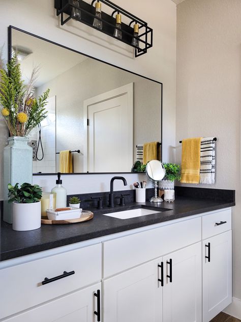 Guest Bathroom Ideas Black Countertop, Black And White Cabinets Bathroom, Boho Bathroom Black Countertop, Black Counter Bathroom Decor, Black Countertop In Bathroom, Black Bathroom Granite Countertops, White Vanity Dark Countertop, Bathroom Interior Design Dark Countertop, Black Counter White Cabinets Bathroom