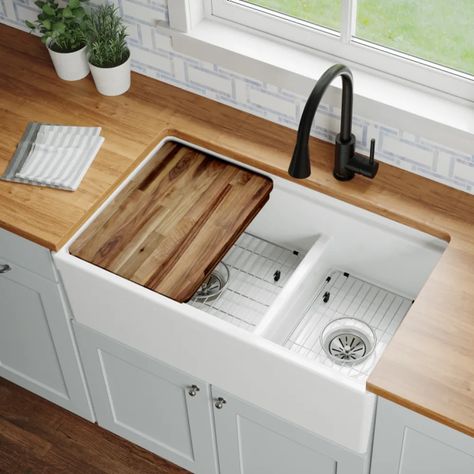 Enhance the beauty of your kitchen with the Elkay F23320CBWHC Workstation double-bowl sink kit. This Fireclay classic sink comes in a neat, white finish that delivers a smooth surface that is easy to clean. The material is inherently sound-deadening and nonporous, ensuring a comfortable experience when using the sink. Furthermore, it is made of a fireclay material that is scratch-resistant, stain-resistant, and durable, increasing its exceptional value in your household. You will always be proud of this beautiful and long-lasting sink!The F23320CBWHC sink is designed for a farmhouse installation that stretches to the front panel and has a low center divider that allows pan handles to extend over the center, making it easy to wash large items. Its overall dimensions are 33" (L) x 19-15/16" Double Sink Kitchen, Minwax Stain Colors, House Laundry Room, Workstation Sink, Apron Front Kitchen Sink, Best Kitchen Sinks, Apron Sink, Wood Stain Colors, Fireclay Sink