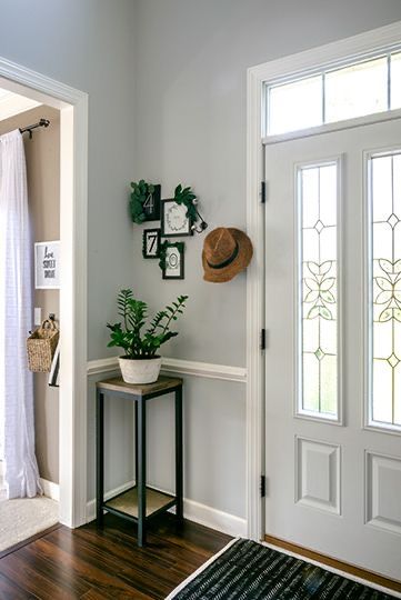 Front Door Corner Decor Inside, Front Door Small Entry, Beside Front Door Decor Inside, Small Wall By Front Door Decor, Space Behind Front Door Entryway, Corner Entrance Ideas Front Doors, Small Entry Corner, Corner Front Door Entrance Decor, Front Door Opens To Stairs Entry Ways