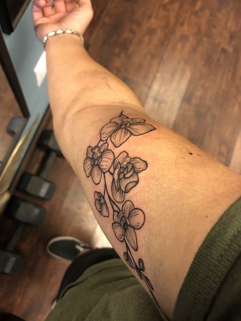 Orchid tattoo on bicep Orchid Tattoo Arm Half Sleeves, Men Orchid Tattoo, Vine Tattoo Bicep, Orchid Arm Tattoos For Women, Orchid Forearm Tattoo, Orchid Sleeve Tattoo, Orchid Vine Tattoo, Orchid Arm Tattoo, Orchid Tattoo Men