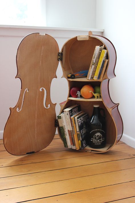 Last fall I received a broken cello from a grade school music teacher and was asked if I could build it into anything neat.  This is what I came up with. Recycle Instruments, Cello Art, Guitar Shelf, Music Furniture, Unique Library, Violin Art, Cello Music, Cellos, Music Decor