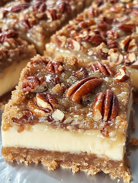 These Pecan Pie Cheesecake Bars combine a buttery graham crust, creamy cheesecake, and a sweet pecan topping for a delightful dessert. Pecan Cheesecake Crust, Pecan Pie Slab Bars, Pecan Pie Topping Recipe, Cheesecake Pecan Pie Bars, Easy Pie Dessert Recipes, Thanksgiving Recipes For Dessert, Pecan Sandies Crust Dessert Recipes, Pecan Pie Cream Cheese Bars, Pecan Pie No Bake Cheesecake Bars