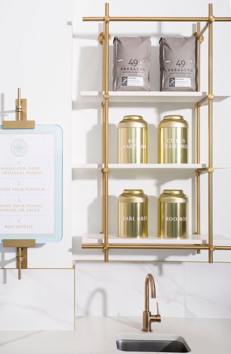 For La Glace ice cream parlor in Vancouver, our hanging Collector’s Shelving Units were designed as displays creating a functional, elegant backdrop while our Modern Easel, shown for the first time in warm brass, has been re-purposed as a menu holder. Shown here with stone shelves, the Collector’s Shelving System once again proves its versatility in retail, hospitality and residential environments. #homedecorideas #shelving #display Island Built Around Column, French Ice Cream, Bistro Shelving, Brass Shelving, Shelving Display, Glass Shelves Kitchen, Joinery Details, Shelving Design, H Design