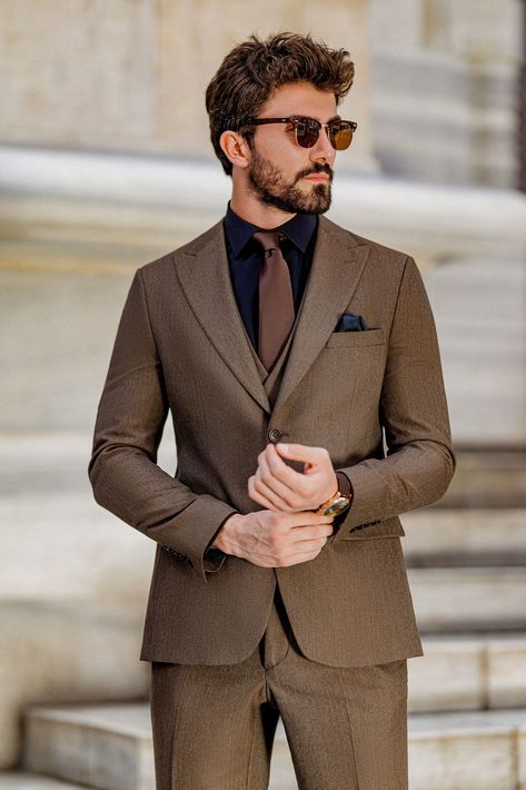 Elevate your formal attire with the Brown Slim-Fit Suit 3-Piece. This suit’s rich brown color and sharp, tailored fit provide the perfect balance of tradition and modernity, ensuring you stand out in any setting.  #brownslimfitsuit #elegantmenswear #classylook #formalfashion #modernfit #tailoredsuit #professionalstyle #sharpdressing #businessattire #menssuit Brown Suit Combinations Mens Fashion, Black And Brown Suit, Brown Suit Outfit, Brown Blazer Outfit Men, Brown Suit Men, 2 Piece Suit For Men, Brown Suit Wedding, Wedding Guest Outfit Men, Brown Suits For Men