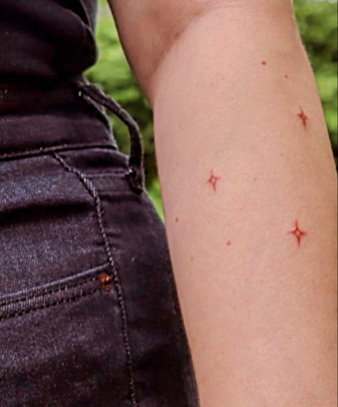 3 stars tattooed on arm Brown Ink Star Tattoo, Star Shower Tattoo, Brown Star Freckle Tattoo, Red Ink Star Tattoo, Red Stars Tattoo, Sparkle Freckle Tattoo, Brown Star Tattoo, Red Sparkle Tattoo, Red Tiny Tattoo