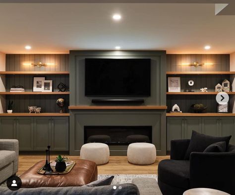 Movie Den Room, Basement Faux Beams, Green Built In Entertainment Center, Built In Entertainment Center Paint Colors, Basement Fireplace With Tv Built Ins, Built In Basement Entertainment Center, Basement Tv Wall Ideas Built Ins, Basement Living Area Ideas, Honey Oak Built Ins