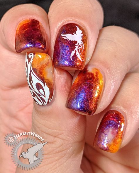 Dance of the Firebird - Hermit Werds - flame-colored duochrome nail art design with a firebird and feathers stamped on top Volcano Nail Art, Phoenix Nail Designs, Phoenix Nail Art, Duochrome Nails, Phoenix Nails, Bird Nail Art, Concert Nails, The Firebird, Star Nail Art