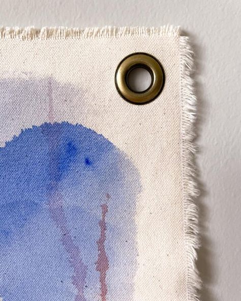 close up detail of a grommet attached to a raw canvas abstract painting in blue Unstretched Canvas Hanging, Diy Painted Tapestry, Painting On Raw Canvas, Raw Canvas Art, Raw Canvas Painting, Hanging Art Installation, Tapestry Diy, Tapestry Painting, Uterus Art