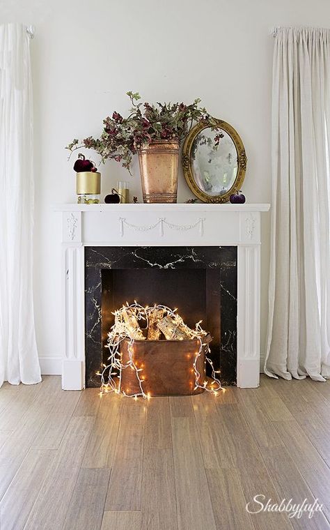 Don't have a fireplace? That's okay! Here's how to still achieve the fireplace look without one! #christmas #winter #decor Faux Foyer, Design Camino, Faux Fireplace Mantels, Fake Fireplace, Faux Fireplace Diy, Candles In Fireplace, Shiplap Fireplace, Fireplace Logs, Small Fireplace