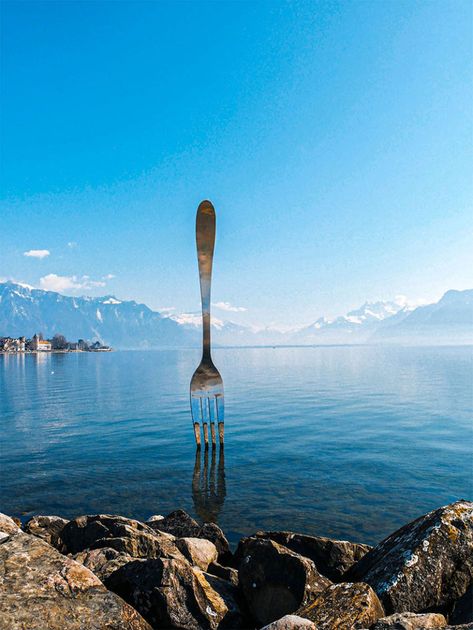 The Fork is a surreal sculpture in the lake at Vevey, Switzerland Surreal Sculpture, Vevey Switzerland, Basel City, Lake Thun, Places In Switzerland, Switzerland Cities, Vevey, Luxury Destinations, Countries In The World