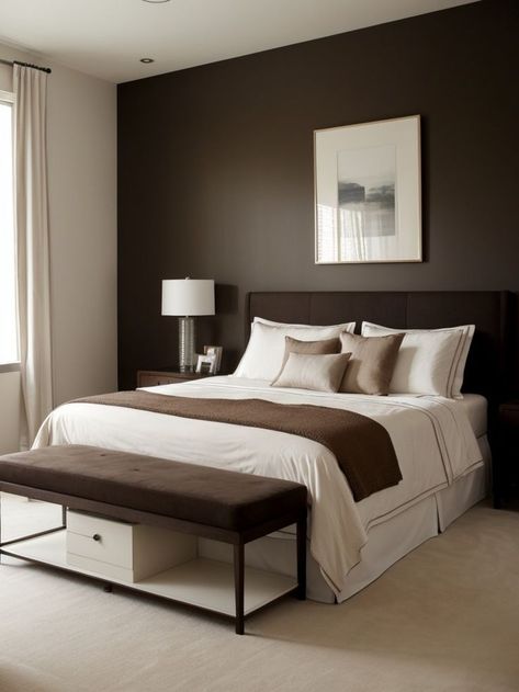 Create a chic and modern bedroom by painting an accent wall in a rich chocolate brown shadePair it with a sleek white bed frame and plush cream bedding for a sophisticated look. Chocolate Brown Accent Wall, Brown And Cream Bedroom, Painting An Accent Wall, Brown Bedroom Walls, Chocolate Bedroom, Dark Brown Bedrooms, Brown Bed Frame, Cream And White Bedroom, Brown Accent Wall