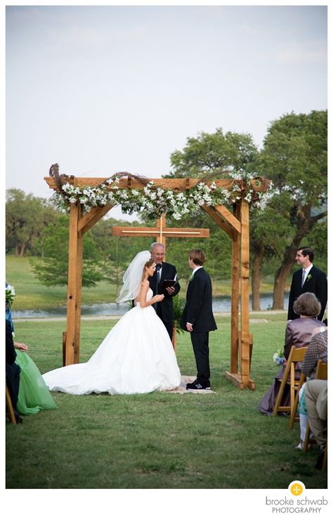 Love the cross in the background. floral arch Outdoor Wedding Backdrops, Wedding Arches Outdoors, Cross Wedding, Diy Wedding Arch, Wedding Alters, Wedding Arbor, Backyard Weddings, Diy Wedding Backdrop, Wedding Backdrops