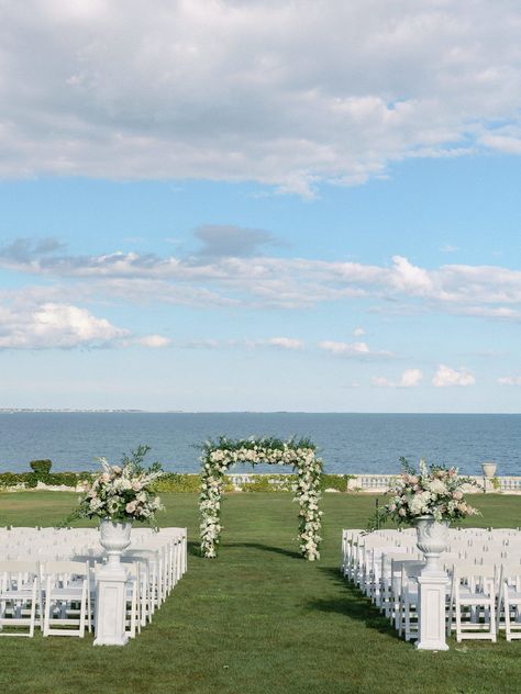 Outdoor ceremony at Rosecliff Newport Mansion with floral arbor and ocean views. Photography By Halie | Boston and New England Rosecliff Mansion Wedding Ceremony, Wedding Venue New England, Ocean House Wedding, New England Wedding Aesthetic, Mansion Outdoor, Wedding Hamptons, Rosecliff Mansion Wedding, Floral Arbor, Rosecliff Mansion