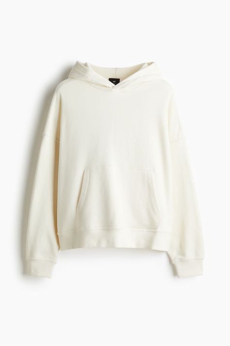 Oversized sweatshirt hoodie in heavyweight cotton fabric with a soft  brushed inside and extra-loose silhouette. Double-layered  wrapover hood  heavily dropped shoulders  long sleeves  and a kangaroo pocket. Ribbing at cuffs and hem. Cream Hoodies, H&m Hoodie, Wishlist Ideas, H&m Men, Man Clothes, Cream Hoodie, Plain Hoodies, Athletic Clothes, Trendy Hoodies